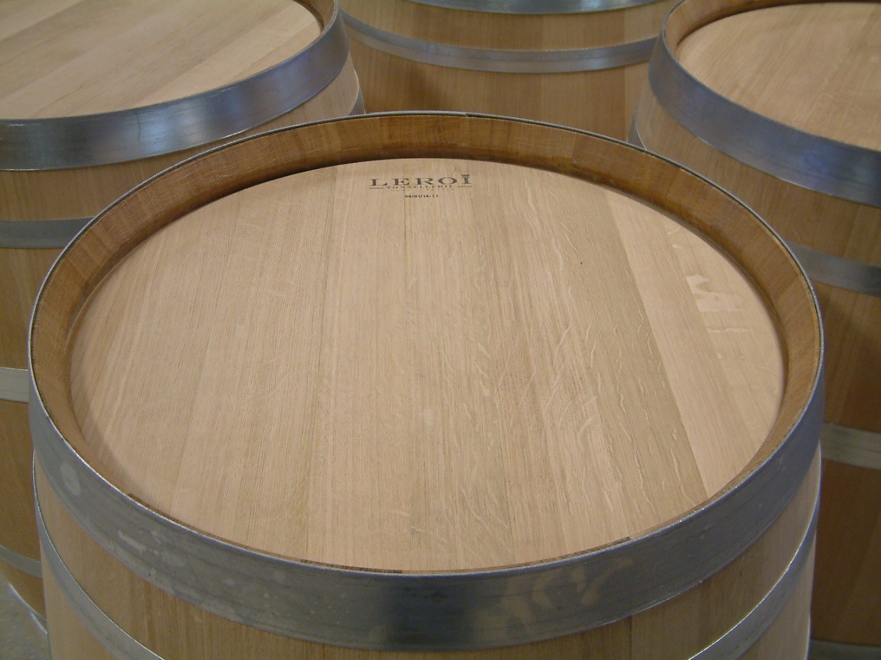 Tops of new oak barrels lined up at the cooperage